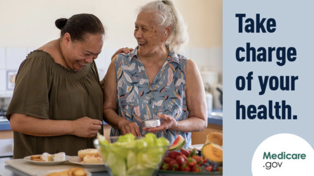 The image is a promotional graphic for Medicare.gov, featuring a photograph of two women in a kitchen environment sharing a joyful moment. One woman appears to be older with gray hair, wearing a sleeveless blue top with a leaf pattern, while the other is a younger adult with her hair pulled back, wearing a green top. They are both smiling and looking at a piece of paper or a card that the older woman is holding. On the table in front of them are various healthy food items like lettuce, melon, and strawberries, suggesting a focus on a healthy lifestyle.  The right side of the image has a blue background with the text "Take charge of your health." in white lettering, conveying a message of empowerment and personal health management. Below the main message is the Medicare.gov logo, indicating that this is an official communication from Medicare. The design of the graphic is clean and clear, with a positive and friendly tone, encouraging viewers to utilize the resources provided by Medicare for their health and well-being.