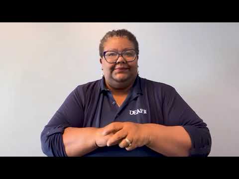 Thumbnail of Darian Gambrell, DEAF, Inc.’s Executive Director. She is wearing a navy blue DEAF, Inc. long-sleeved shirt, black glasses, and has her arms slightly crossed. Thumbnail of Darian Gambrell, DEAF, Inc.’s Executive Director. She is wearing a navy blue DEAF, Inc. long-sleeved shirt, black glasses, and has her arms slightly crossed.