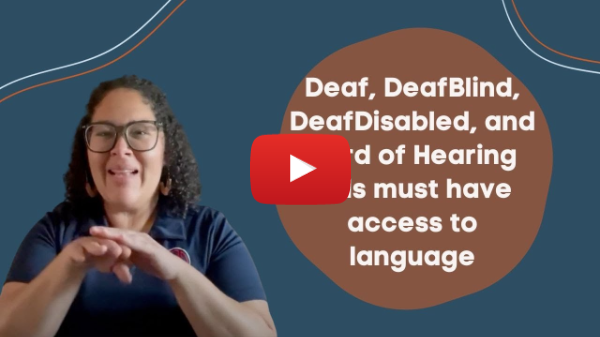 A YouTube still of a woman signing access in front of a sea blue background next to a blue circle with the following white text words, “Deaf, DeafBlind, DeafDisabled, and Hard of Hearing [blocked out] must have access to language