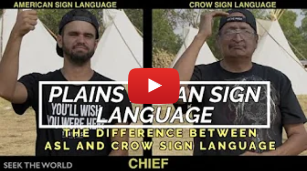 A YouTube still of 2 men signing “Chief” in both ASL and Crow Sign Language. The text below at the center says, “Chief” and to the bottom left says, “Seek the World.”